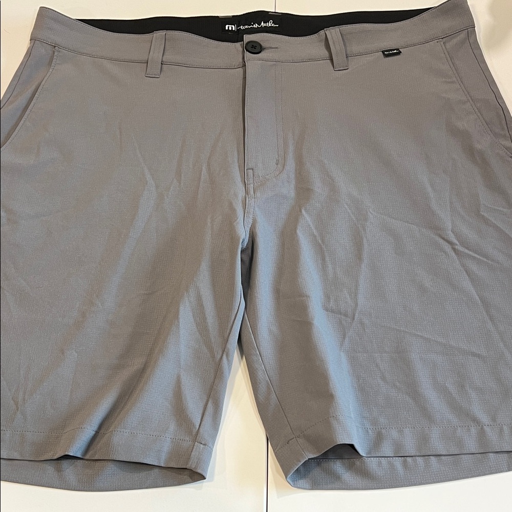 Travis Mathew - 38, light weight gray flat front shorts